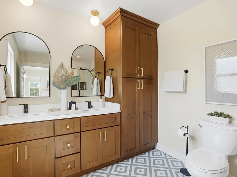 Updated spa-inspired primary bathroom with dual vanities
