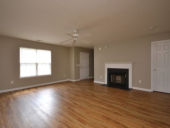 Family room has wood burning fireplace
