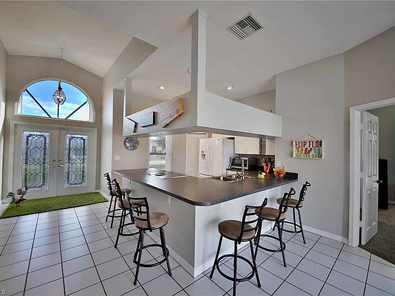 Huge breakfast bar seats six for casual dining!