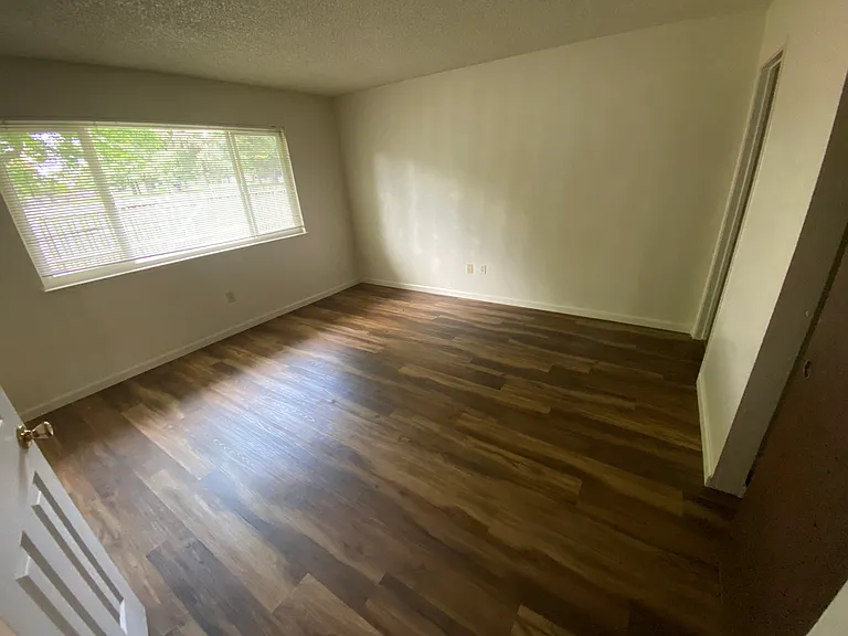 new floor and newly painted master bed room with beautiful view to the park