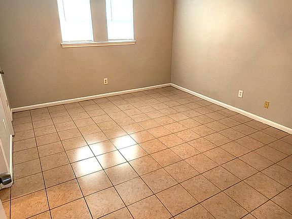 Spacious and well lit room.