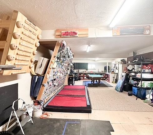 Climbing wall, pool table, storage