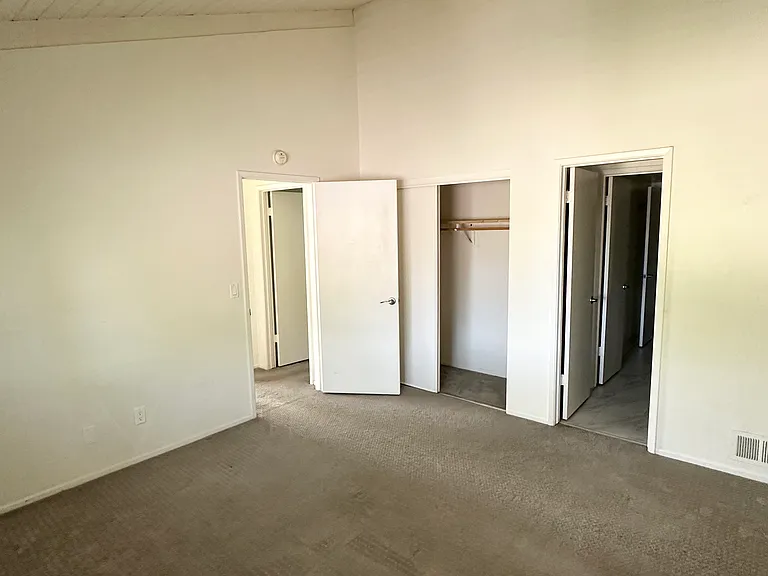 Second bedroom facing bathroom and large closet