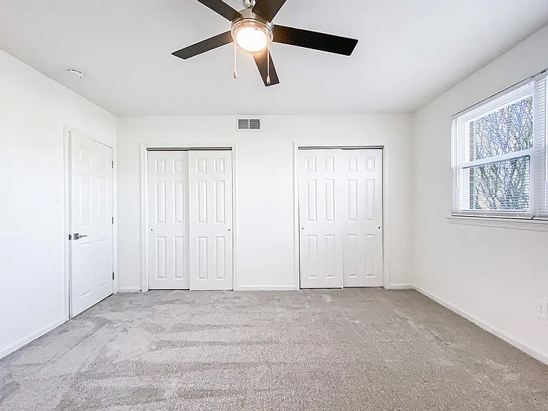 Bedroom with large closets