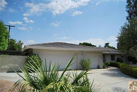 Two car garage and carport for parking.