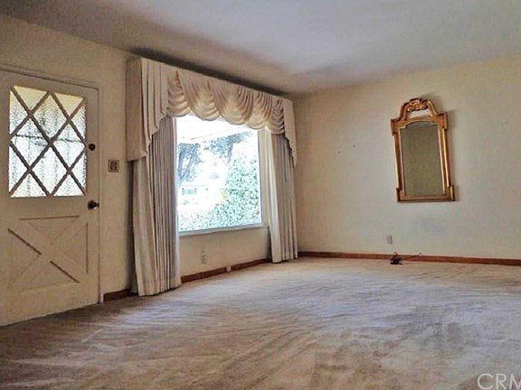Open to the living room with a large window