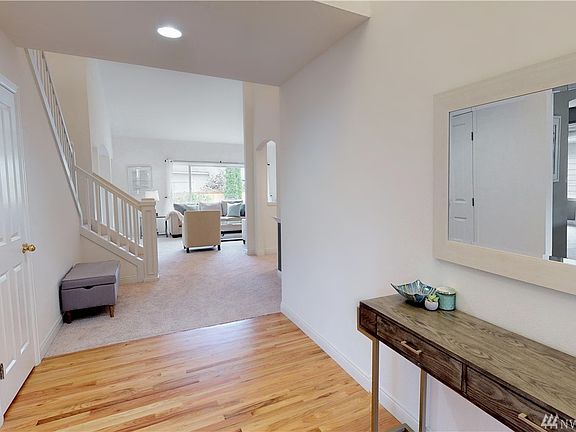 All refinished hardwoods and brand new carpets in the home