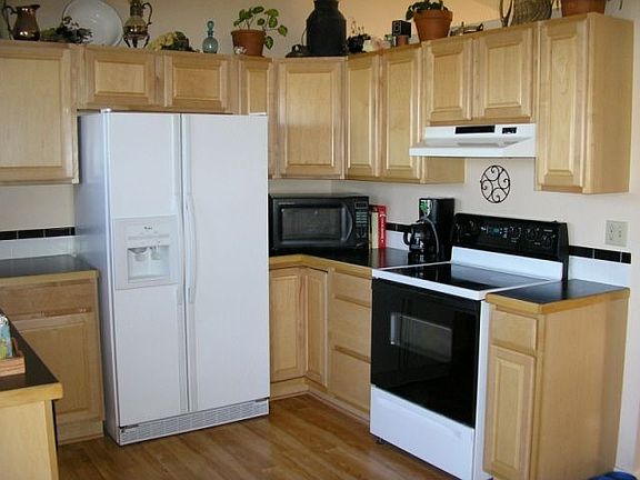 Gorgeous updated kitchen with maple cabinets and smooth-top stove