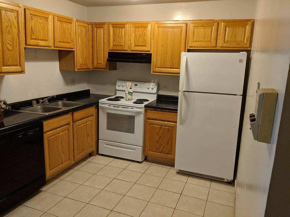 Tiled kitchen with relatively new appliances