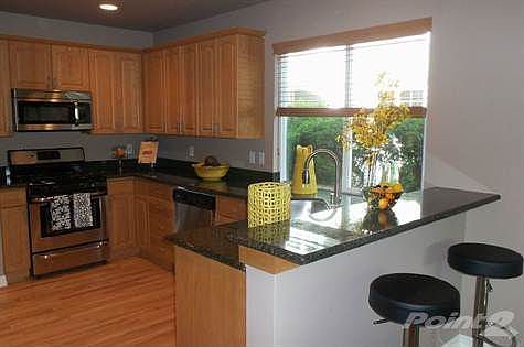 Slab Granite Kitchen Counters w/ Bar Seating Area
