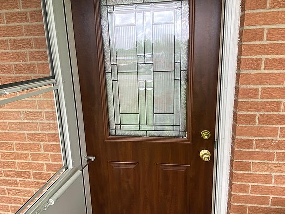 This is the new front door. The new storm has a screen that hides into the door when not in use.