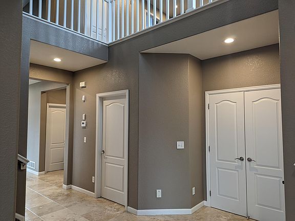 View of the entry area coat closet, entrance to the mud room / laundry room and hallway.