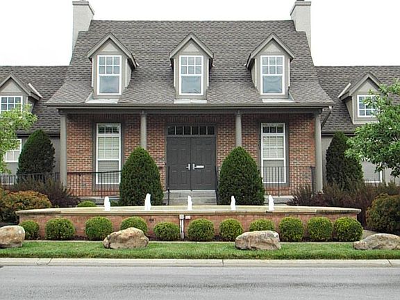 Clubhouse with fireplace in gathering area, kitchen & fitness room.