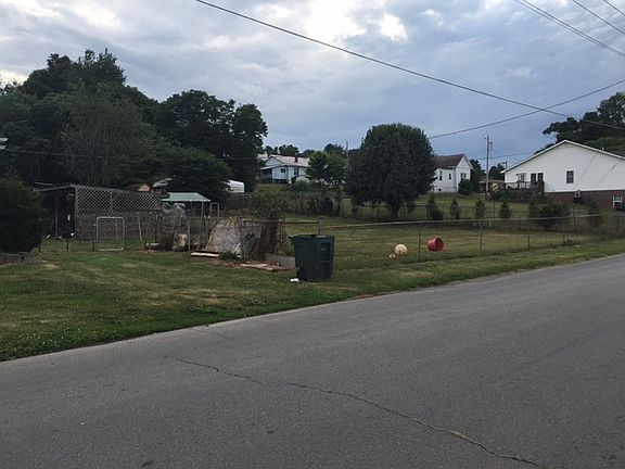 vacant adjacent fenced in lo