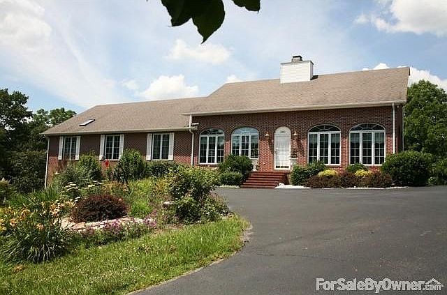 Front of house and upper driveway
