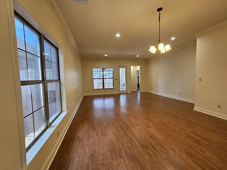 Open dining and living room area with lots of natural light
