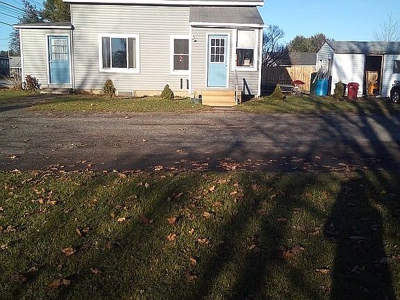 side yard/driveway/house