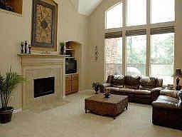 The two-story family room is central to this home and features dramatic, soaring ceilings.