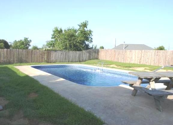 Inground pool with privacy fence