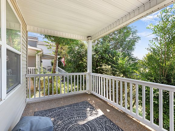 Beautiful spacious & shaded front porch looking towards West Park