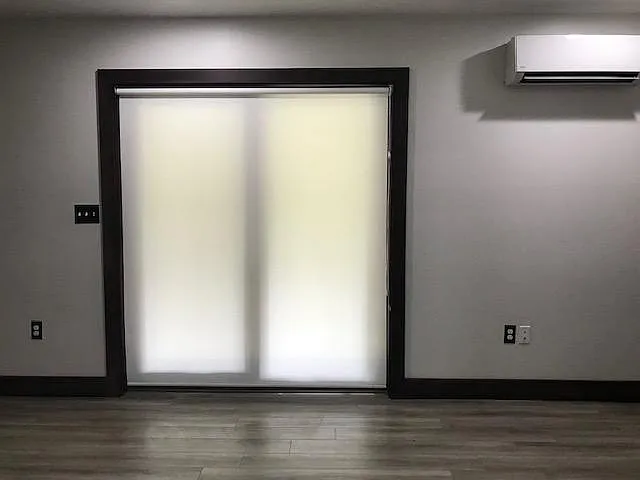 Sliding Door in Living Room area with window blinds