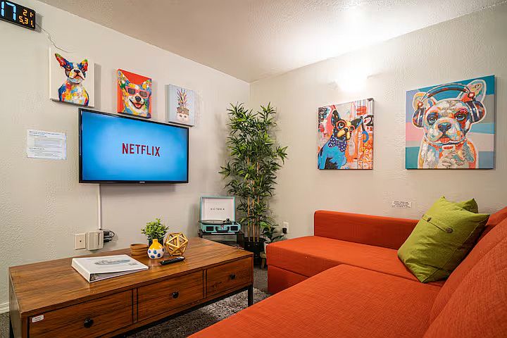 Large living room#1 with everything you need to kick back and relax, including a smart TV, various board games and a sectional sofa that can be pulled out to a comfortable queen size bed.