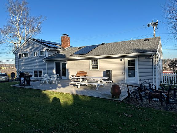 Large paved patio with access from the dining room and separate back entrance into mud room/laundry room.