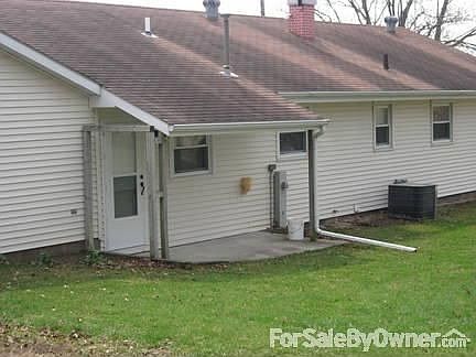 Back of house with covered porch