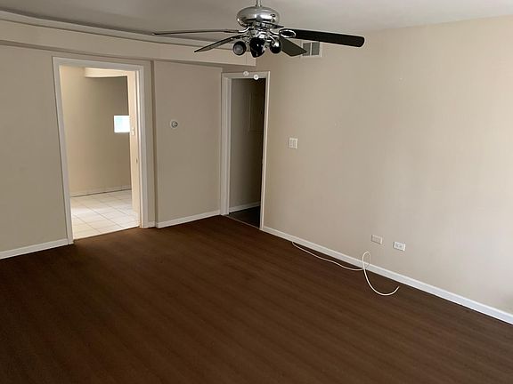 Living Room (facing Kitchen area on Left, Hallway to Bedroom and Bathroom on Right)