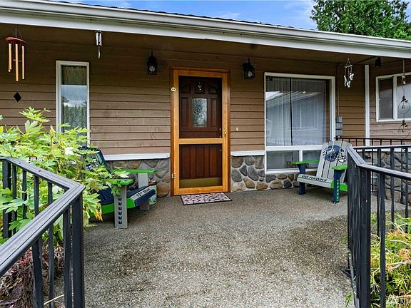 Easy, no-stair access to front door! Enjoy the view of your own Koi Pond with waterwheel from the front patio area!