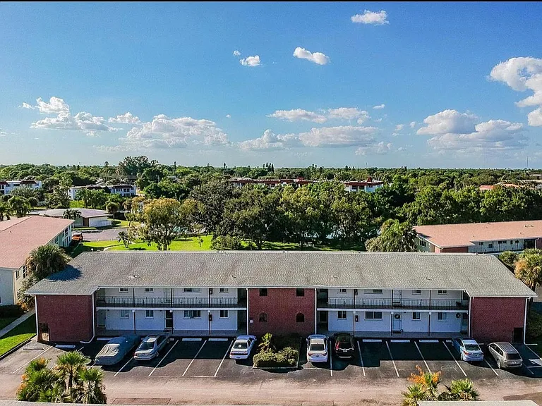 Condo is upstairs in the left center.