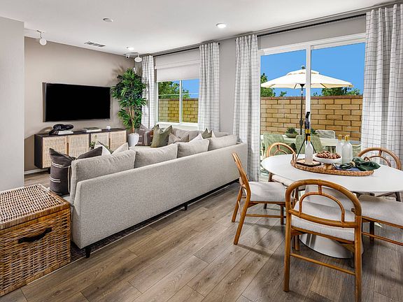A photo of the dining and great room in the Row Plan 5 model home.