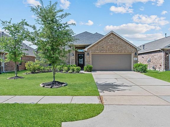 Beautiful landscaping welcomes you and is a breeze to take care of with a full sprinkler system!