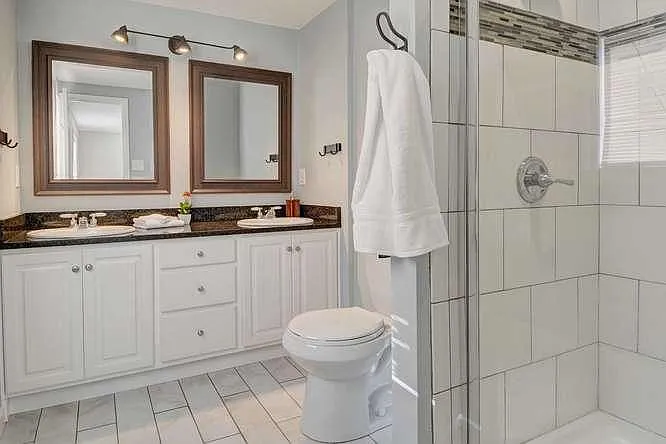 Master bath, two sinks, roomy glass enclosed shower