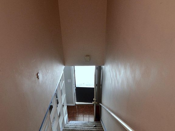 stairwell up to the bedroom and full bath