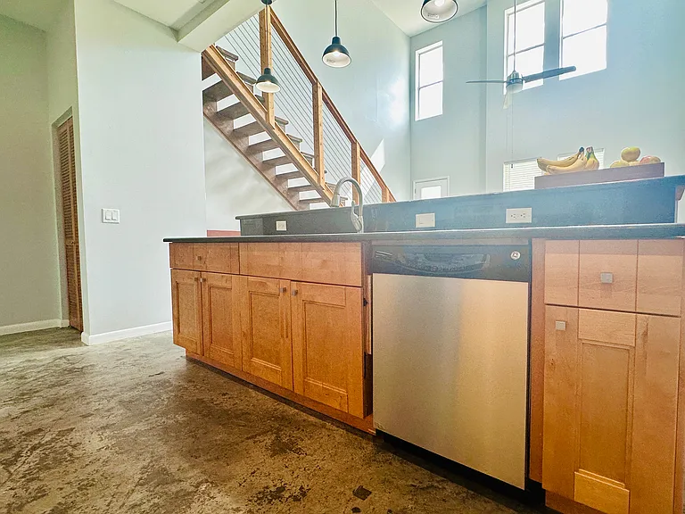 Granite Counter Bar with European Wood Cabinets and Dishwasher