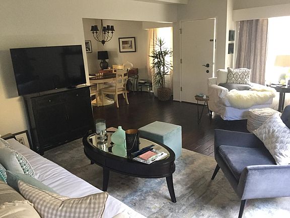 Open Floor plan. Dark wood flooring throughout. No carpet for easy maintenance.