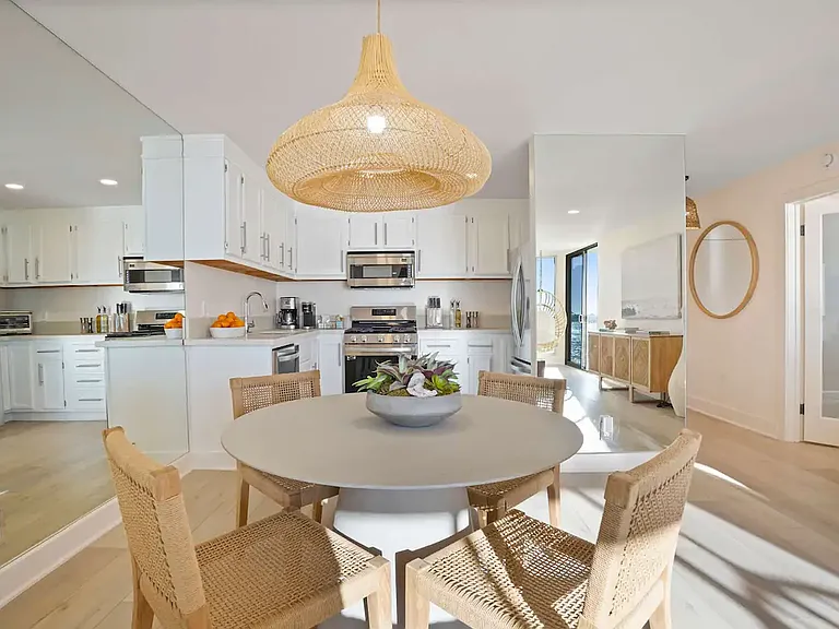 Sleek, fully equipped kitchen and dining area, perfect for home-cooked meals and gatherings.