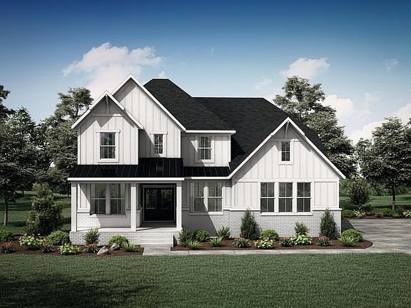 brick, board and batten house with front porch