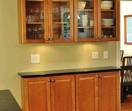 Kitchen has Jenaire gas stove, lighted cabinets stainless ap