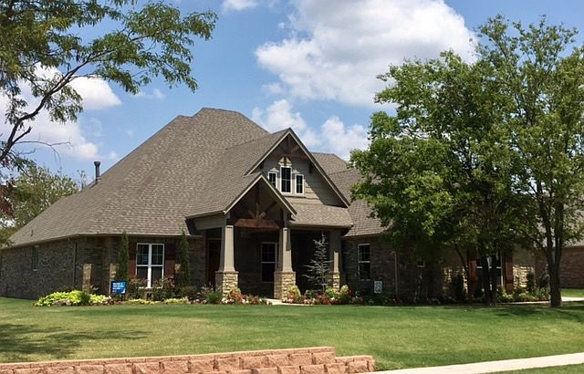 Front Exterior with Porch, Gray Smeared Morter on Landmark Fine Homes Model Home