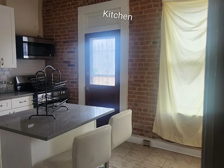 Kitchen facing back door.
