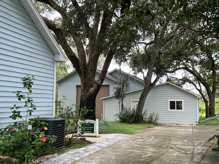 A look at the back of the property. The cottage in the rear is another unit, a studio apartment