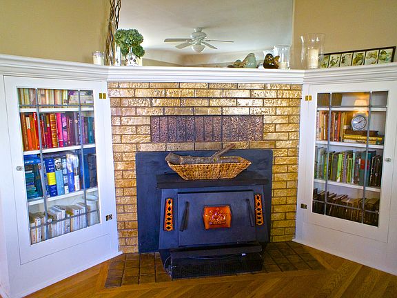 Wood burning fireplace and built-in bookshelves