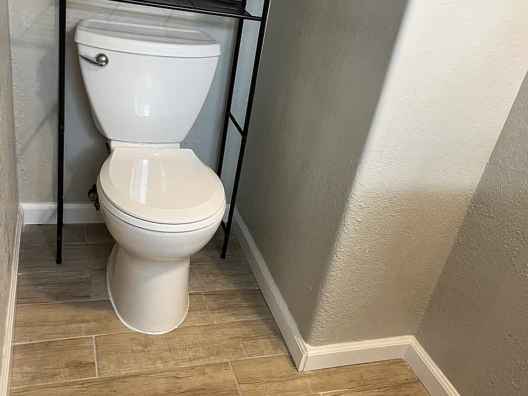 new toilet & tile flooring