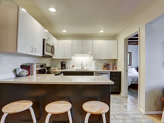 first floor, kitchen/counter and view into first floor guest room