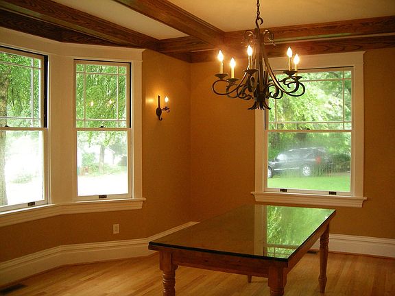 Dining room with box beamed ceiling