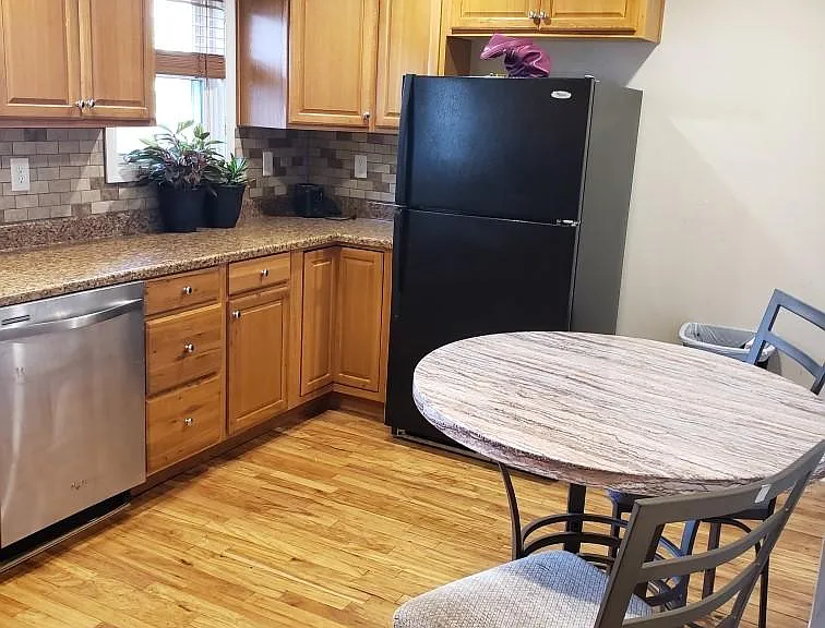 Original hardwood floors in the kitchen.