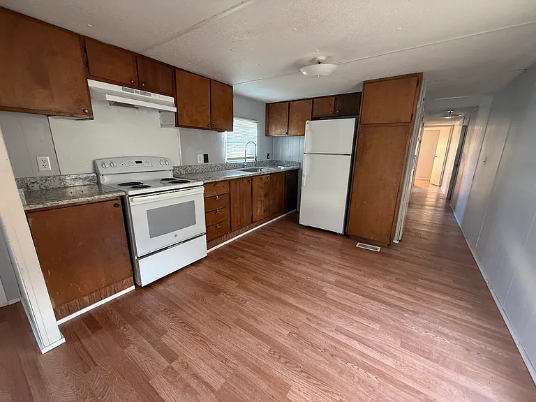 Kitchen area. New fixtures and granite countertops.