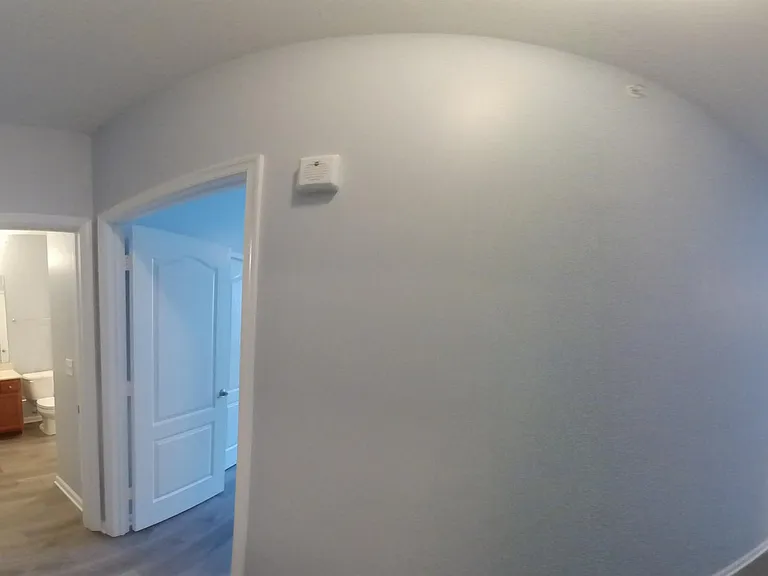 NOTE: Wall is NOT curved, picture is intended to show relationship of rooms. Please see video too.